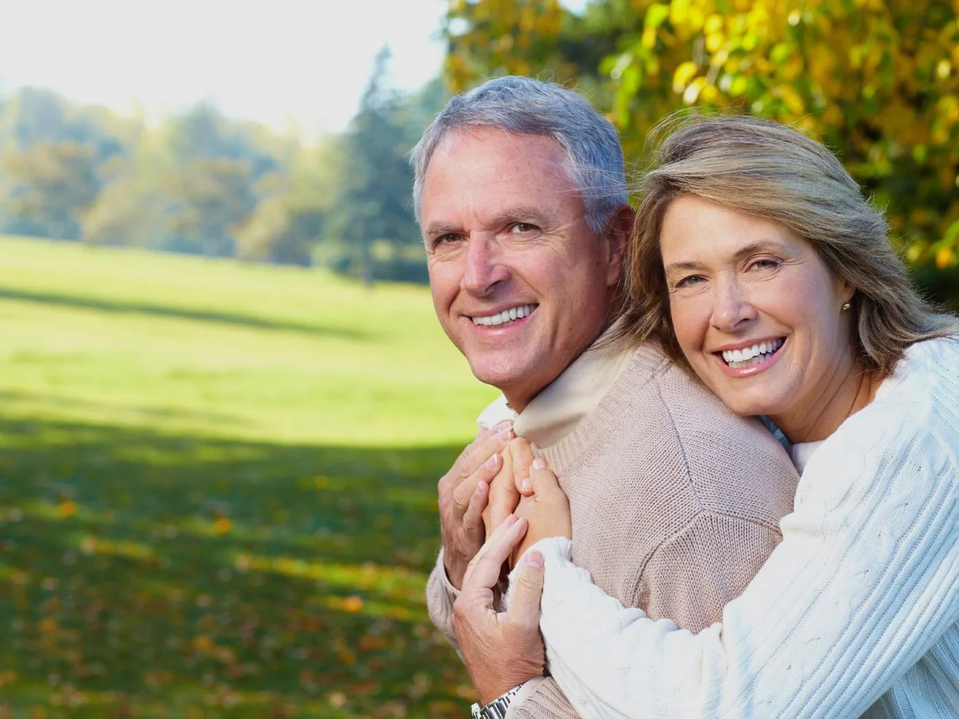Smiling older couple enjoying a sunny day outdoors